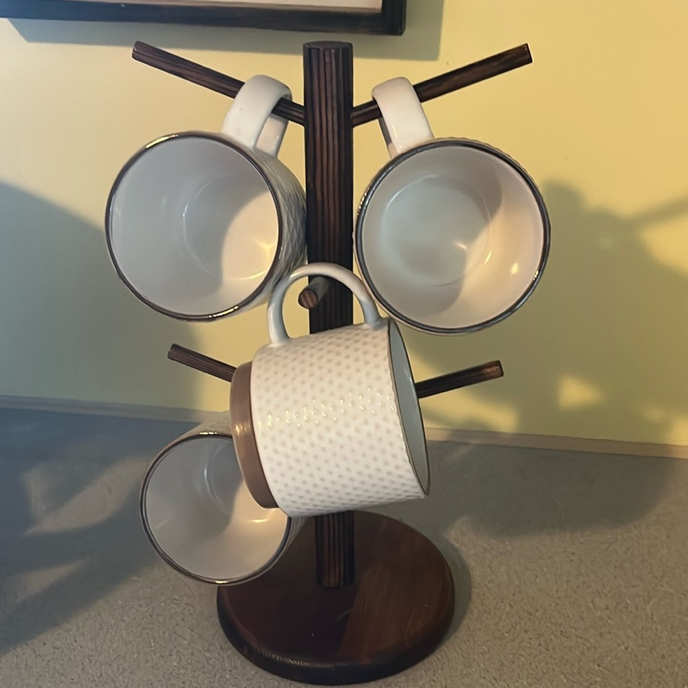 Coffee mugs and stand- Each mug has a different design